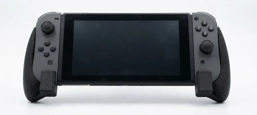 Ергономічні ручки для Nintendo Switch, пластикові, чорні - зображення 1